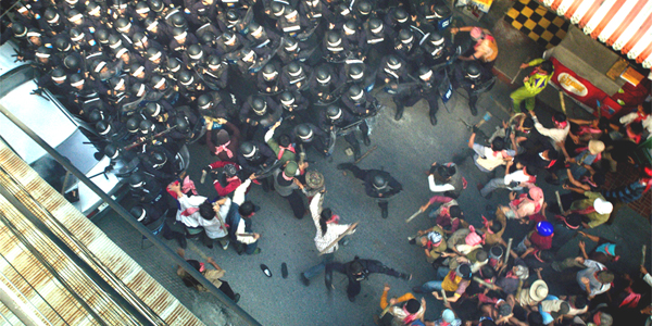 A riot begins in NO ESCAPE