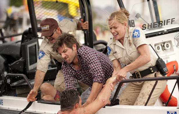 Novac (Scott) and Julie (Shue) try to save a spring breaker