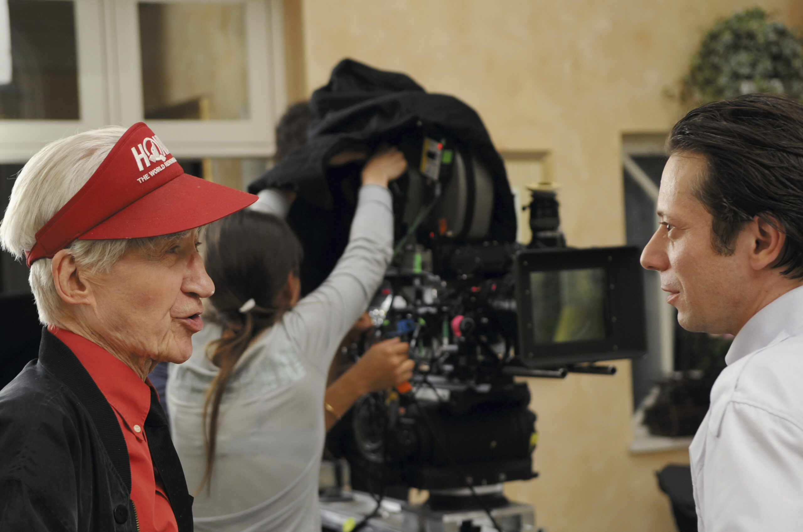 Director Alain Resnais going over a scene with Mathieu Amalric