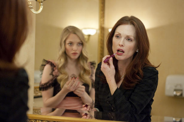 Chloe (Seyfried) and Catherine (Moore) meet in a rest room