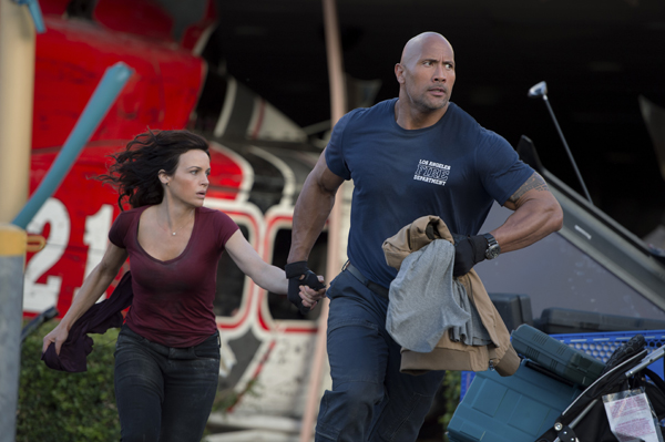 Carla Gugino as Emma and Dwayne Johnson as Ray are on the run from disaster