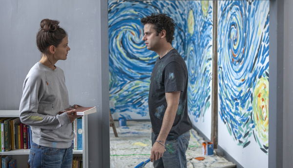 Carla (Katie Holmes) and Marco (Luke Kirby) work out a problem in TOUCHED WITH FIRE