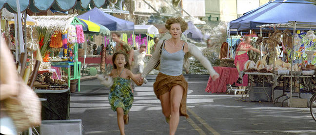 Marie (de France) and a child run from the tsunami