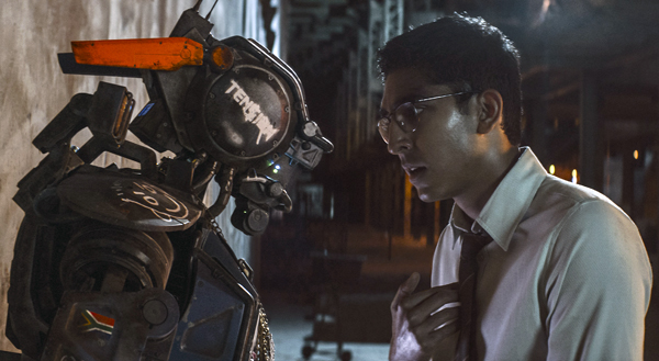 Chappie (Sharlto Copley) with master Dion (Dev Patel)