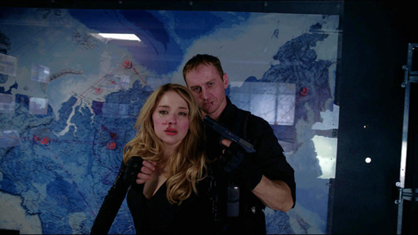 Estelle (Haley Bennett) being held by Akan (Danila Kozlovsky)