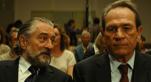 Fred (DeNiro) and Agent Stansfield (Jones) in THE FAMILY
