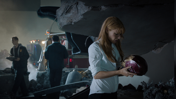 Pepper Potts (Gwyneth Paltrow) looks a a damaged Iron Man face plate