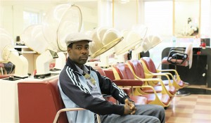 Chris Rock waits his turn to speak to stylist