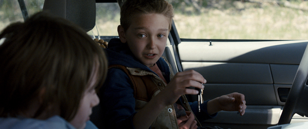 Harrison (Hayes Wellford) and Travis (James Freedson-Jackson) find the keys to the cop car