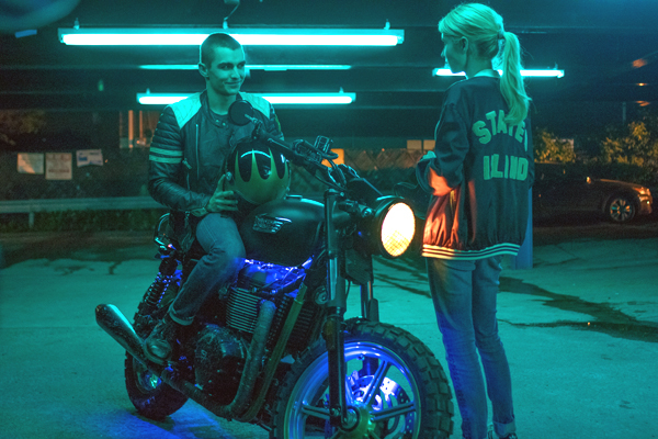 Ian (Dave Franco) tries to get Vee (Emma Roberts) on his bike in NERVE