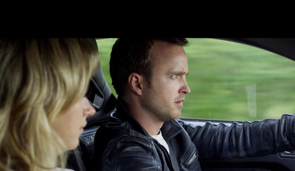 Imogen Poots as Julia and Aaron Paul as Tobey