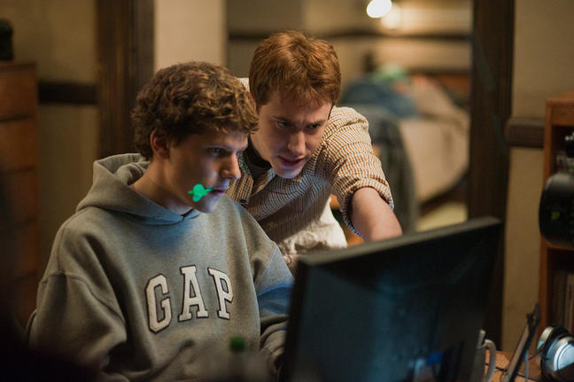 Eisenberg as Zuckerberg working on Facebook