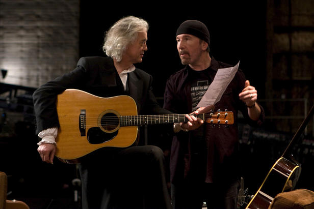 Page and The Edge go over a song
