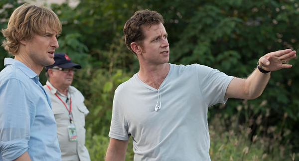 John Dowdle goes over a scene with Owen Wilson on the set of NOT ESCAPE