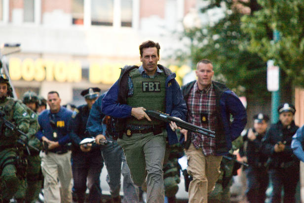 Agent Frawley (Jon Hamm) races to the crime scene