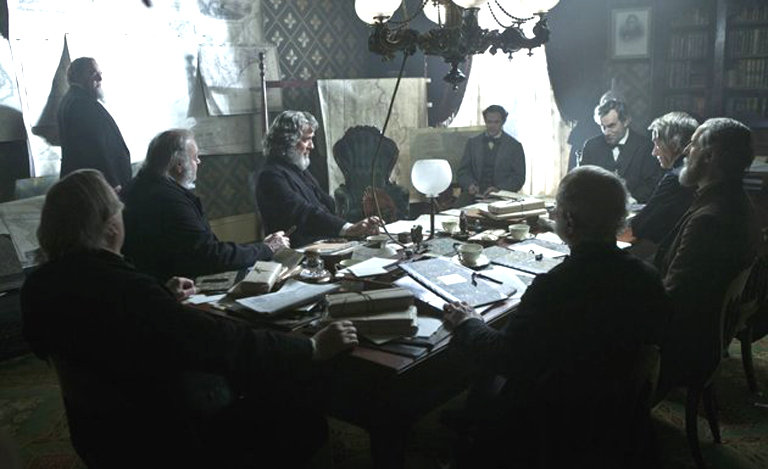 Daniel Day Lewis as Lincoln sitting with his cabinet