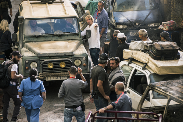 Left to right: John Krasinski, James Badge Dale and Director Michael Bay on the set of 13 Hours: The Secret Soldiers of Benghazi from Paramount Pictures and 3 Arts Entertainment / Bay Films in theatres January 15, 2016.
