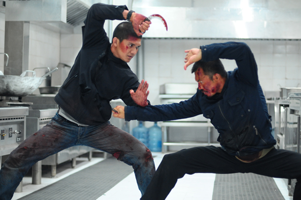 Rama (Iko Uwais) fights The Assassin (Cecep Arif Rahman)