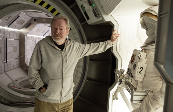 Ridley Scott poses on THE MARITAN set of the spaceship Hermes.