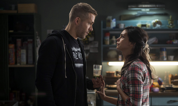 Wade Wilson (Ryan Reyonlds) and new squeeze Vanessa (Morena Baccarin) trade some pointed barbs, in DEADPOOL