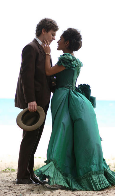 Shaun Evans and Q'Orianka Kilcher kiss on a Hawaiian beach