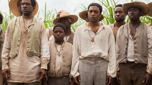 Solomon stands with other slaves in an opening shot of 12 YEARS A SLAVE