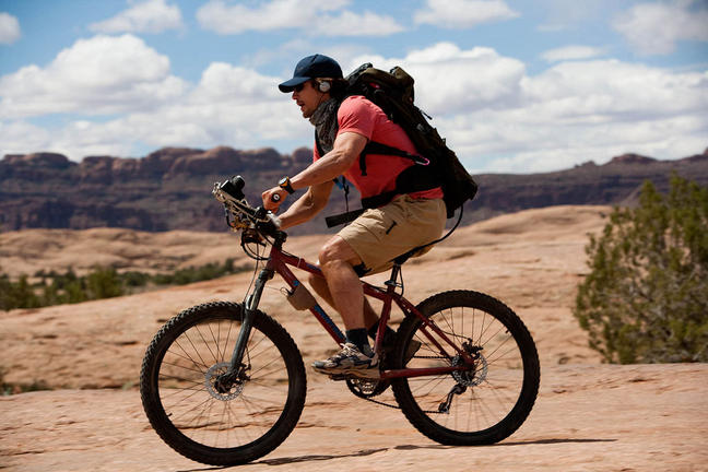 James Franco as Aron Ralston biking in Utah