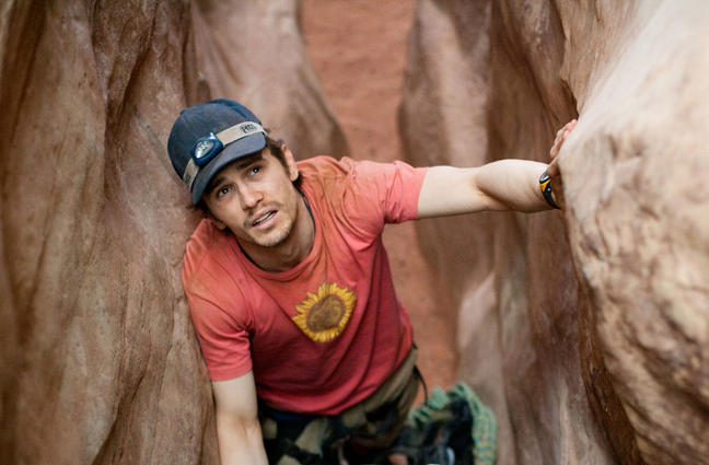 Aron (Franco) climbs through a crevasse