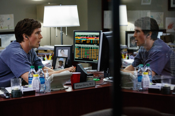 Christian Bale looks over the mortgage numbers in THE BIG SHORT